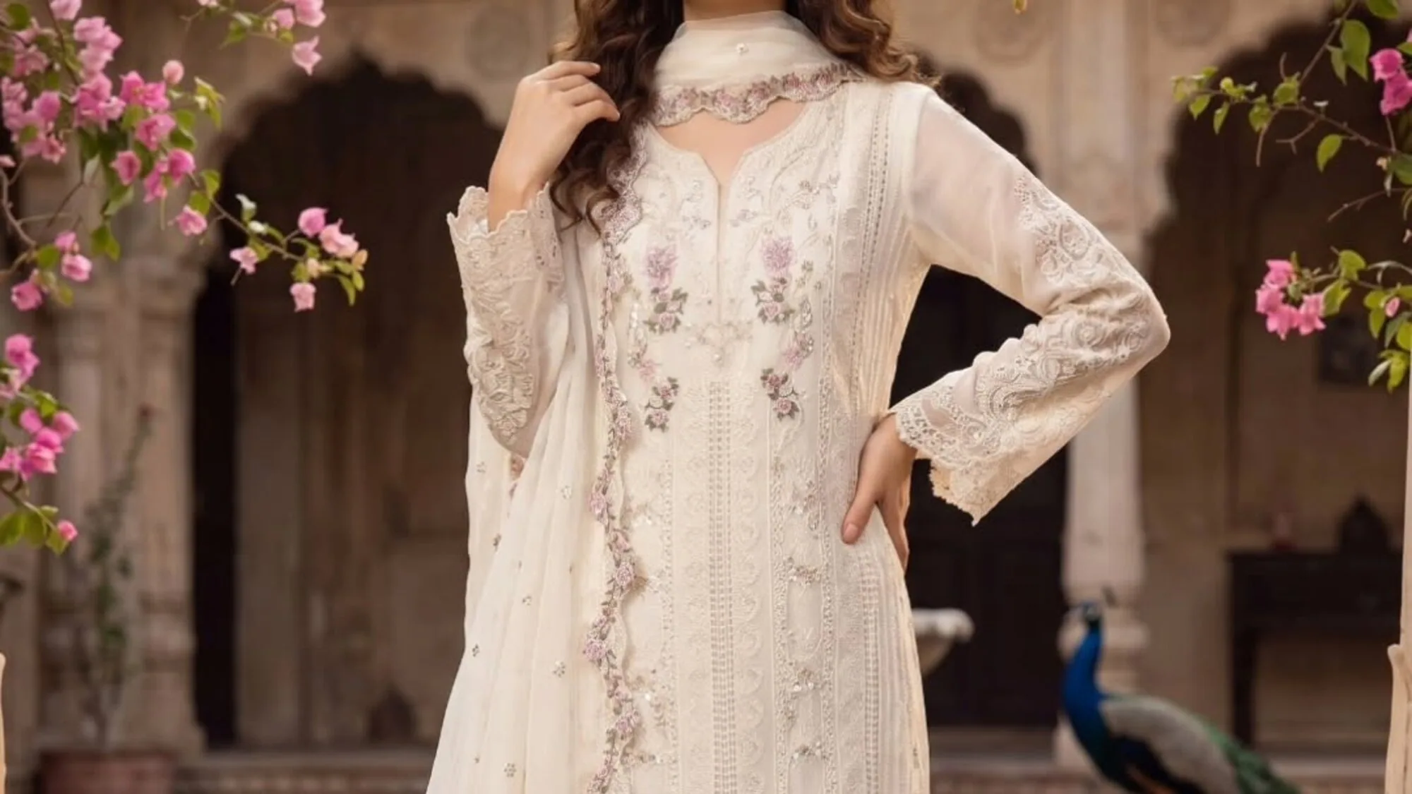 Ivory embroidered kurta set in a heritage courtyard